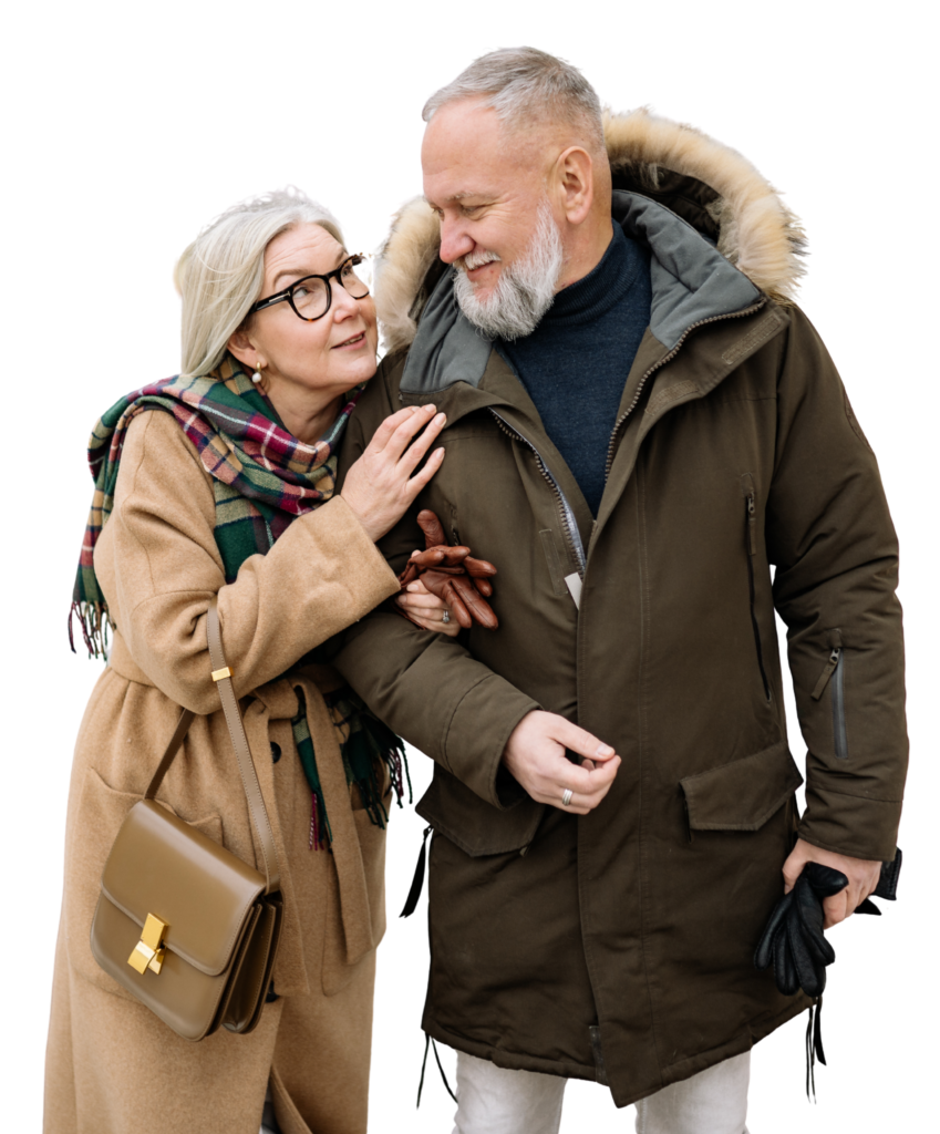Senior couple wearing winter jacket while walking