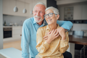 Two couples smiling watching outside