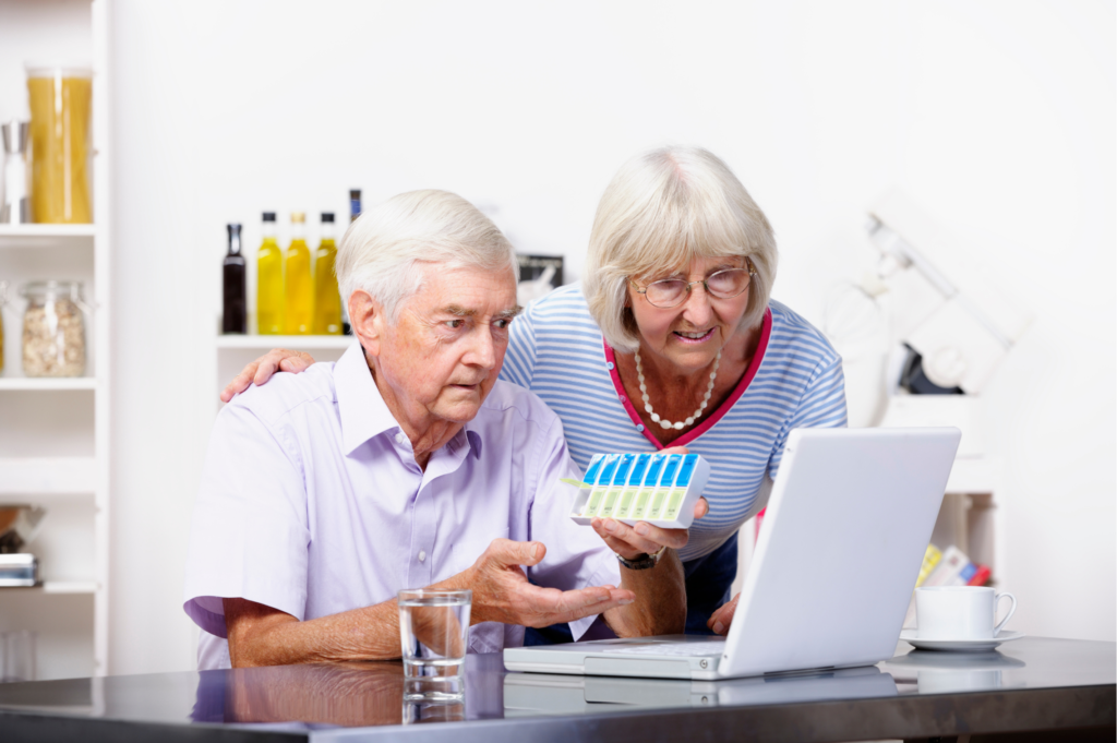 Senior couple reviewing Medicare prescription drug coverage and medications