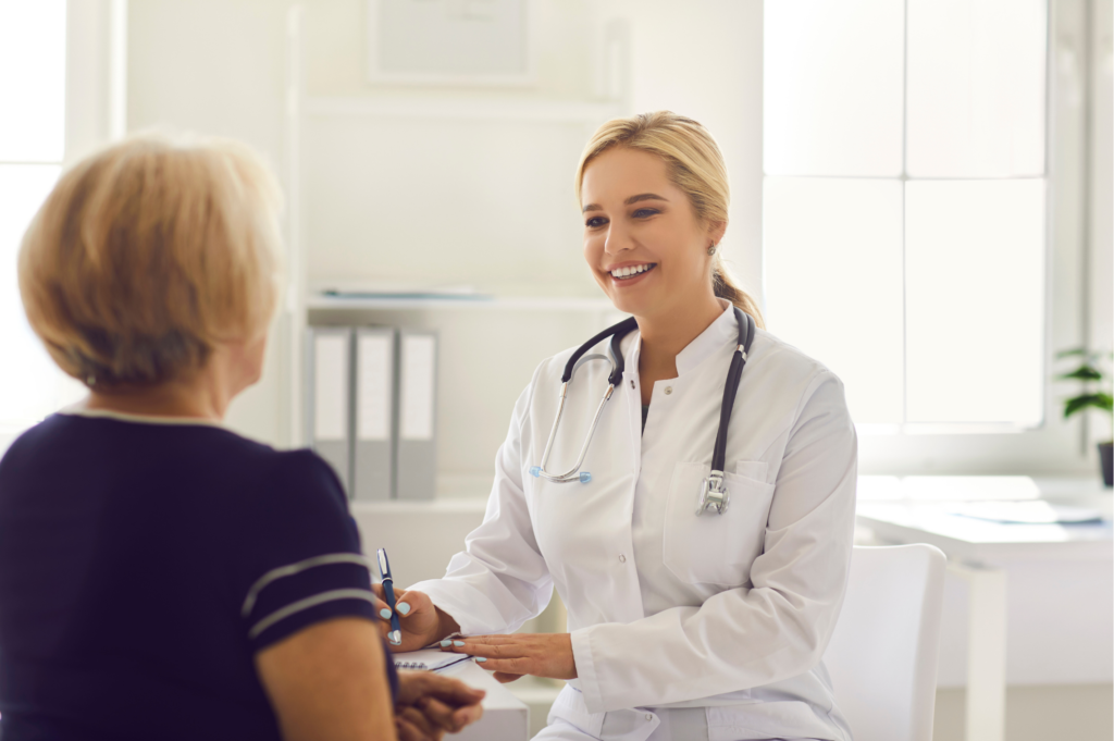 Senior woman discussing preventive care with her doctor during a wellness visit