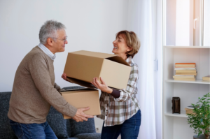 Senior couple reviewing Medicare coverage after moving to a new home
